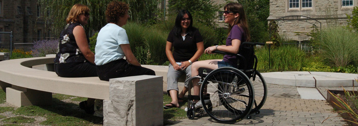 Staff sitting in Ivey Garden